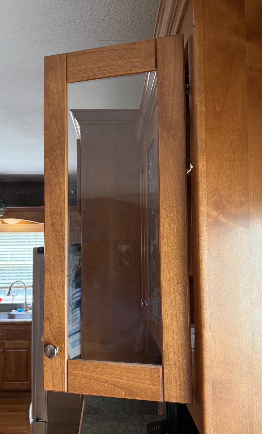 Kitchen cabinet with plain clear glass door before the upgrade