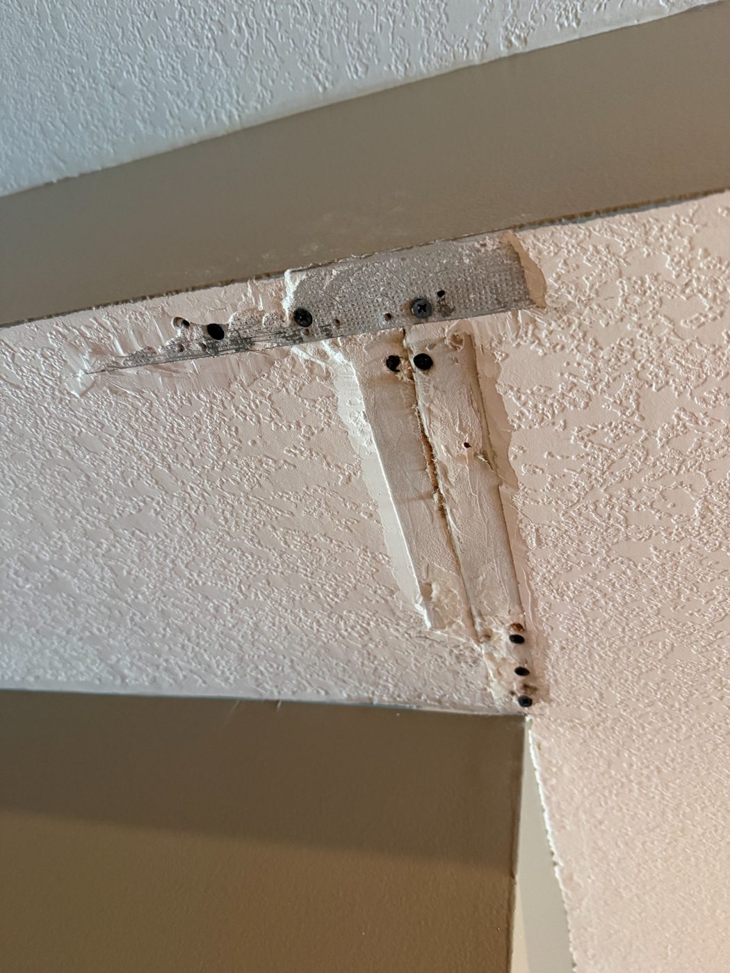 Ceiling crack taped and mudded during the repair