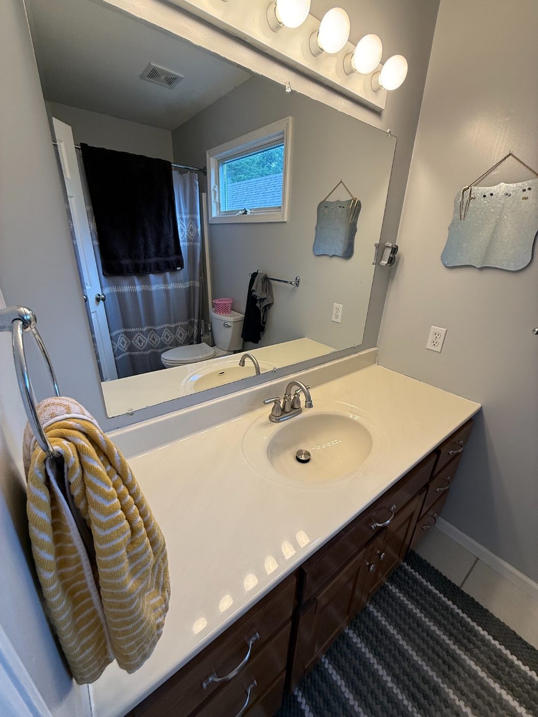 Bathroom vanity with the new brushed nickel faucet installed